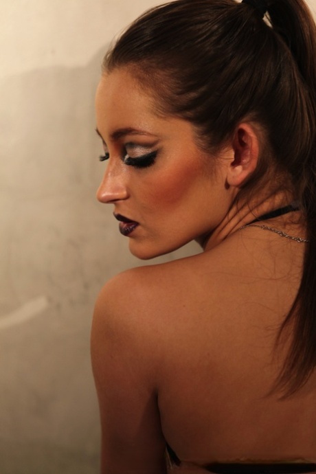 Erotic MILF pornstar Dani Daniels in leather pants poses with nipples bare 27144497