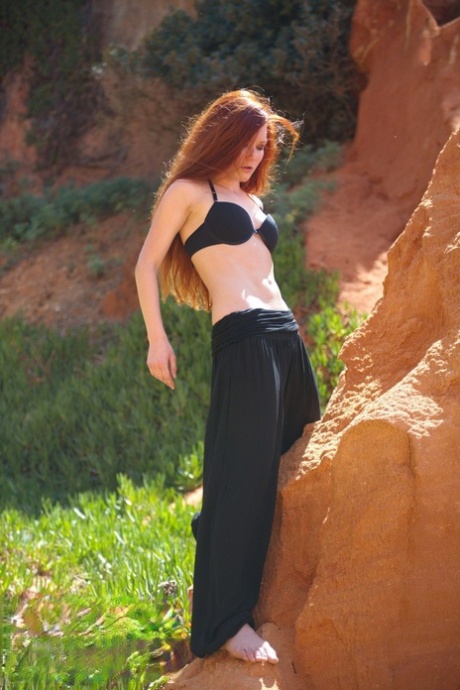 Natural redhead Mia Sollis strikes a yoga pose while getting naked in nature 22272537