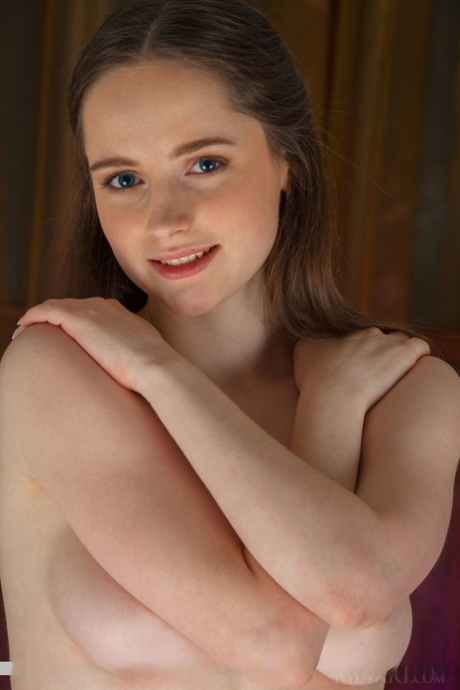 Sweet young Nessie spreads naked in bare feet to show bald pussy close up 86054229