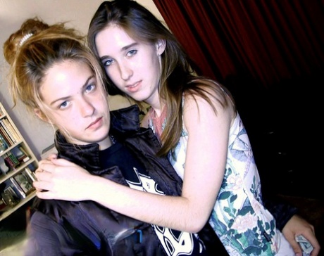 Teen lesbians Maisey and Samantha take a selfie before going nude on a bed 32834360