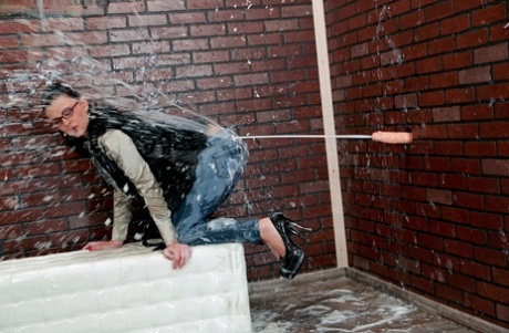 Brunette chick removes her glasses while getting covered in cum at a gloryhole 15855415