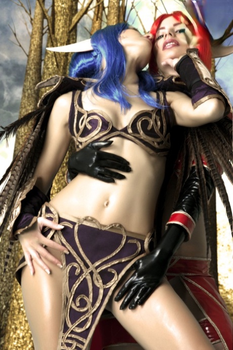 Lesbian cosplayers fondle each other during a fantasy shoot 48538008