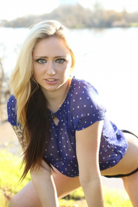 Blonde amateur Lily Xo teases near a body of water in black panties 22211511