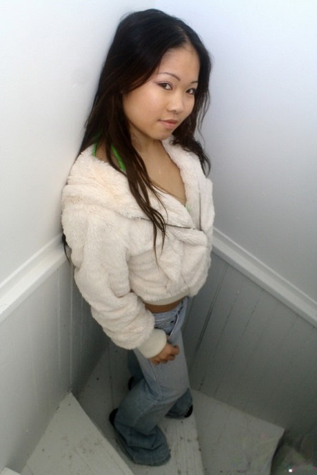 Asian first timer Grace removes her hooded coat to model in a bikini 18197712