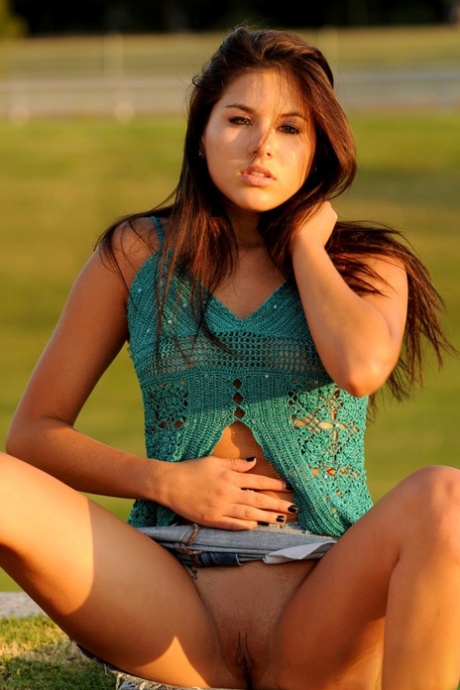 Young amateur Shyla Jennings licks her lips while exposing herself in a field 36482366