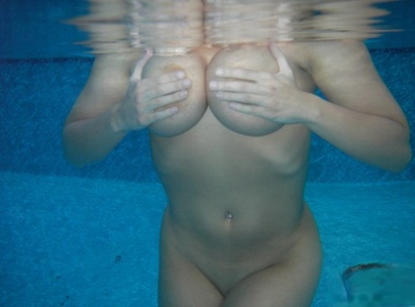 Amateur model Sweet Krissy takes off her bikini while submerged in a pool 57341403