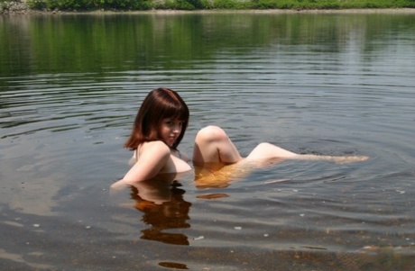 Teen amateur B4rbi3 removes her sunglasses while naked in a body of water 70765562
