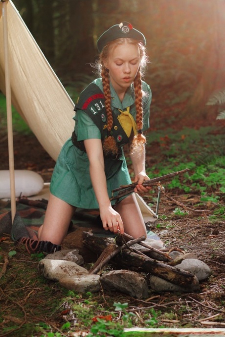 Redheaded Girl Scout Dolly Little gets naked outside her tent in beret 44557876