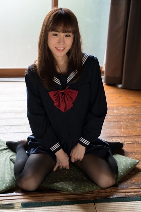Japanese student releases her slim body from her school outfit on a cushion 89937293