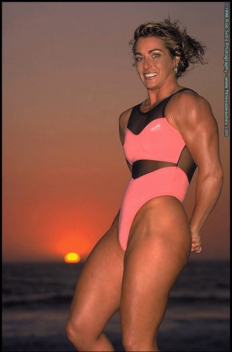 Brunette bodybuilder Kelly Oreilly flexes outdoors in various outfits 58060972