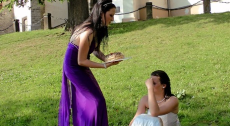 Drunk females in bridal gowns have a cat fight in cobblestone street 71332906