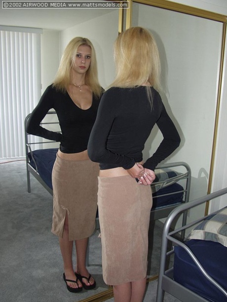Tall blonde Brooke admires her ass in a mirror before getting naked on a bed 59899834