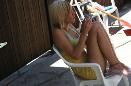 Blonde amateur Princessa smokes a cigarette after posing nude in a pool 67983131