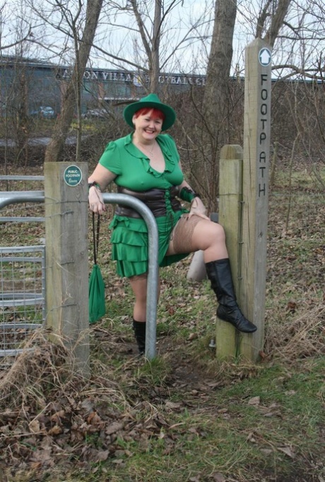 Mature redhead Valgasmic Exposed exposes herself next to a paved road 45057013