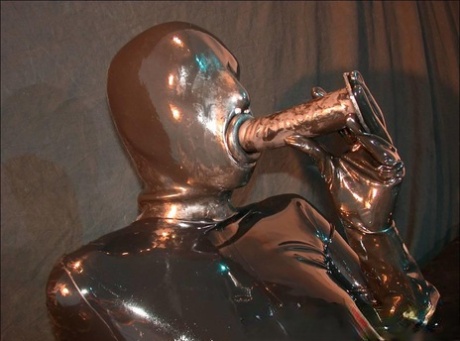 Solo girl unzips head to toe latex clothing in order to masturbate with toys 54615742