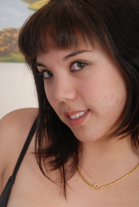 Chubby Latina girl with a pretty face removes black lingerie to pose nude 96372716