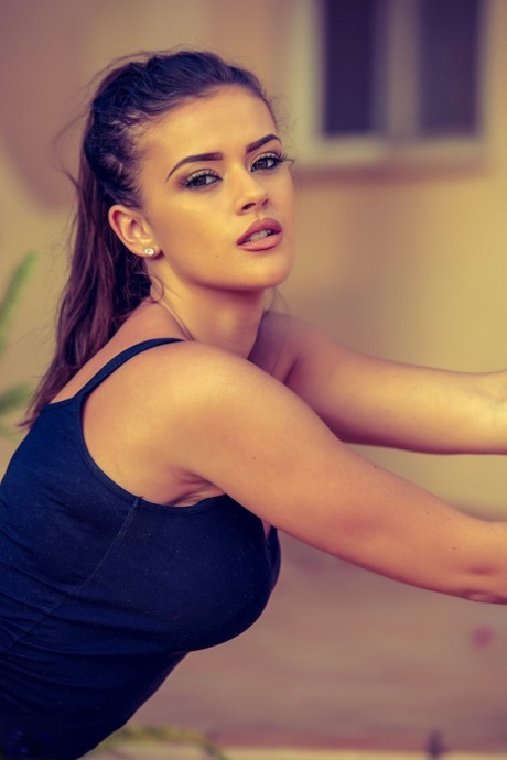 British glam model Brook Wright cups a natural boob after removing her clothes 45180991