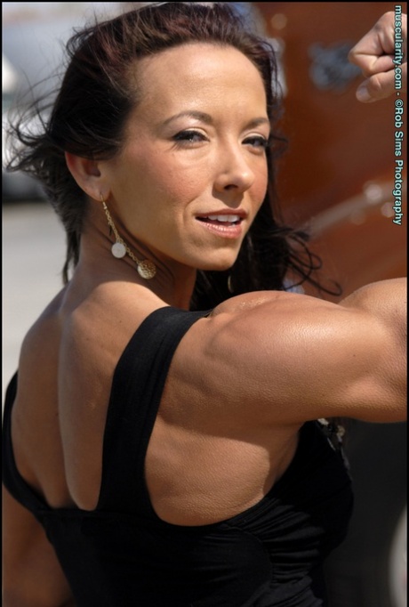 Bodybuilder Patricia Beckman flexes in bikinis and a black dress as well 17839407