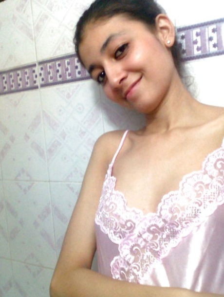 Indian solo girl holds her face firm while letting nipples free of lingerie 69820121
