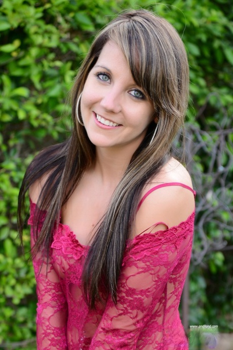 Amateur model Andi Land shows her tits before pulling down a thong in a yard 25603600
