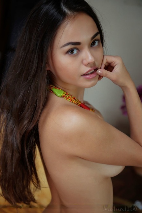 Young Asian girl Li Moon touts her yummy pussy during great nude poses 24871329