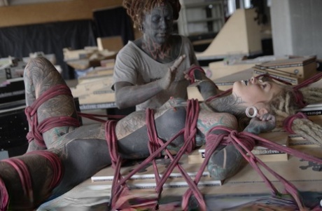 Heavily inked female is restrained with rope by her inked lover 74703654