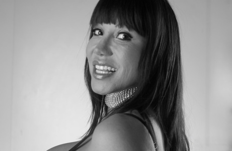 Asian woman Ava Devine pours alcohol on her huge breasts in solo action 87561596
