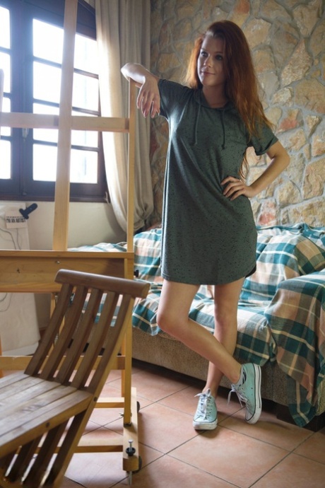 Natural redhead Mia Sollis gets naked by an easel in canvas sneakers 60954586