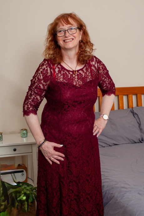 Older redheaded plumper toys her twat while wearing tan stockings and glasses 54799252