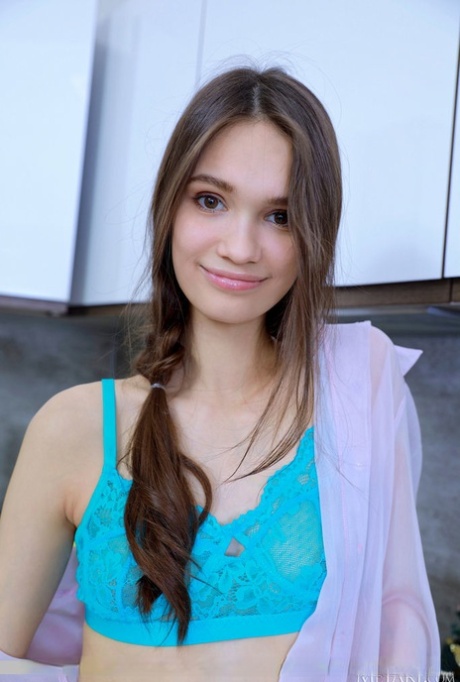 Sweet teen Anastasia Bella puts the focus on her hairless twat while disrobing 69004224