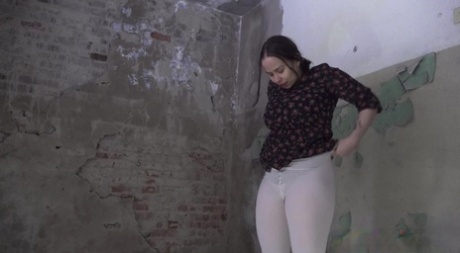 Brunette girl Jessica Stone pulls down white leggings for a badly needed piss 58819204