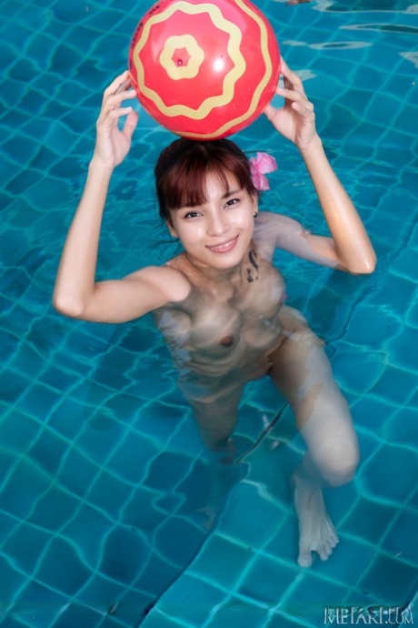 Skinny teen Oopeve gets completely naked while frolicking in a swimming pool 67838502