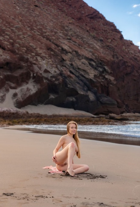 Young beauty gets completely naked on a pristine beach during a solo affair 56148816