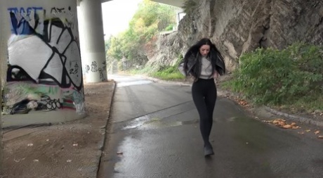 Dark haired girl Shalina Shine takes a badly needed pee on a paved road 64847998