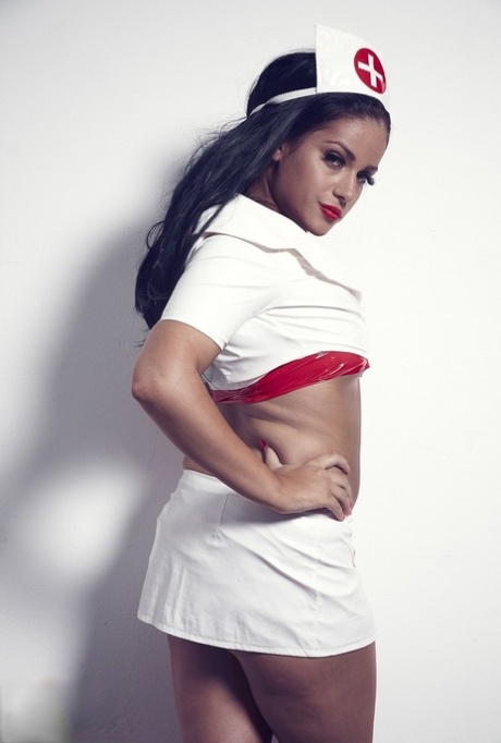 Hot brunette nurse Jasmine Jones doffs her uniform while wearing latex attire 84813094