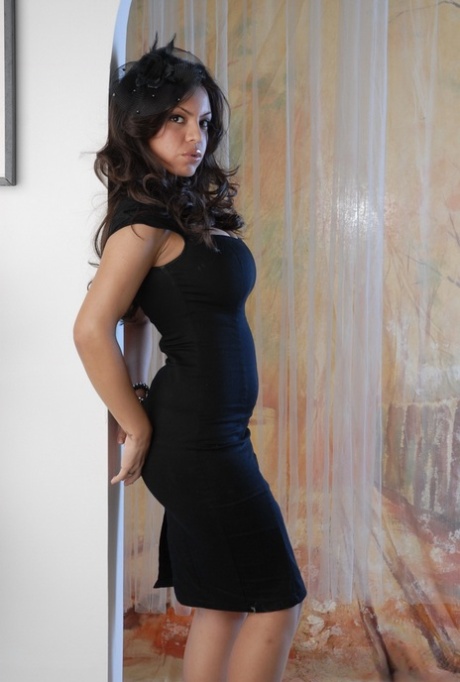 Latina model with a pretty face Yuri Luv poses non nude in a black dress 13328037