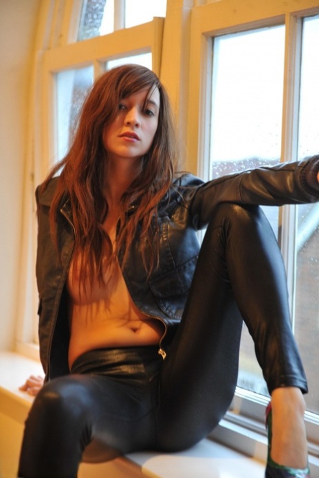Redhead sol model removes her leather jacket and pants in sexy high heels 60911464