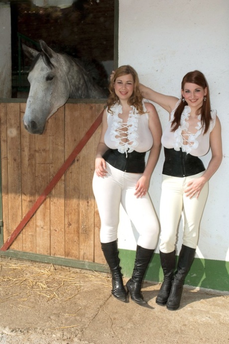 Lesbians Christy Marks and Terry Nova model in sexy riding apparel and boots 21695595