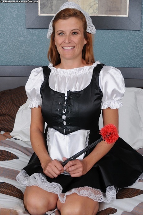 Natural redhead Anita climbs out of her maid uniform to show her ass tattoo 66002543