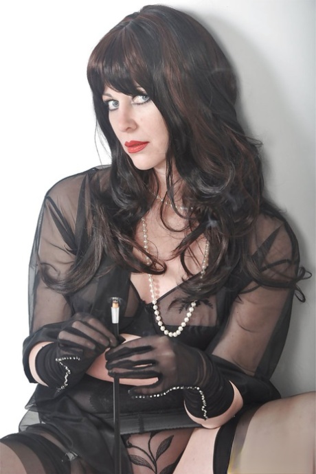 Amazing brunette Helga smoking a cigarette and posing on the sofa 28987955