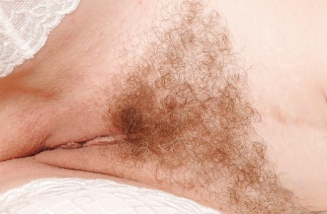 Mature sexy lady Eodit poses naked in stockings with her hairy pussy 18031496