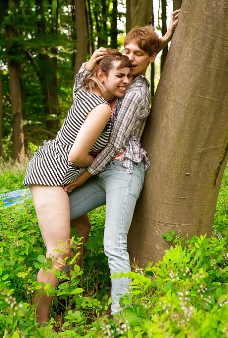 Short haired dykes Anahi and Nora go outdoors to finger each others pussy 65806456