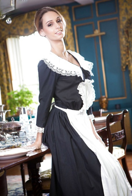 Hot Euro maid Erica Footes flashes thigh and garters before stripping nude 33083186