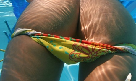 Stunning asian babe Yoko Yoshikawa slipping off her bikini by the pool 21140432