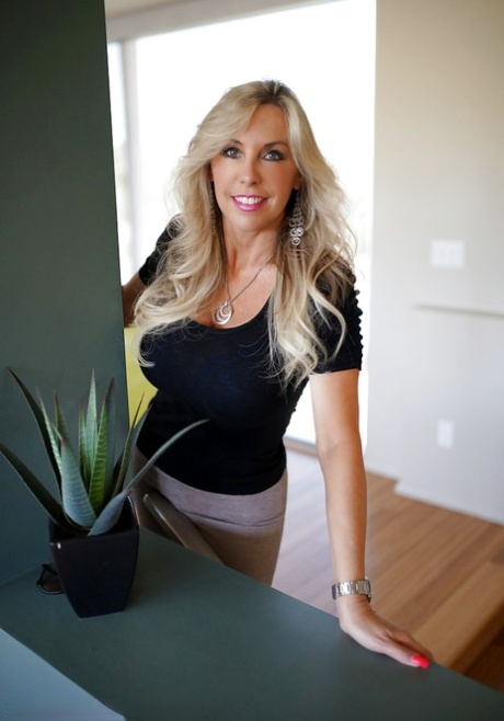 Fully clothed mature bombshell exposes her big tits covered with sexy bra 73623760