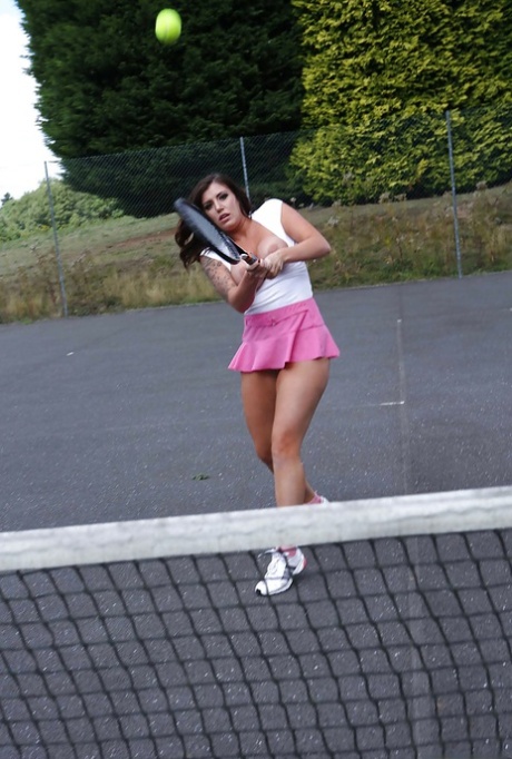 Tatttooed sporty babe revealing her big tits and fingering her gash outdoor 17328480